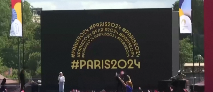 Paris Tourists Welcome Olympic Flame Plans on Eiffel Tower